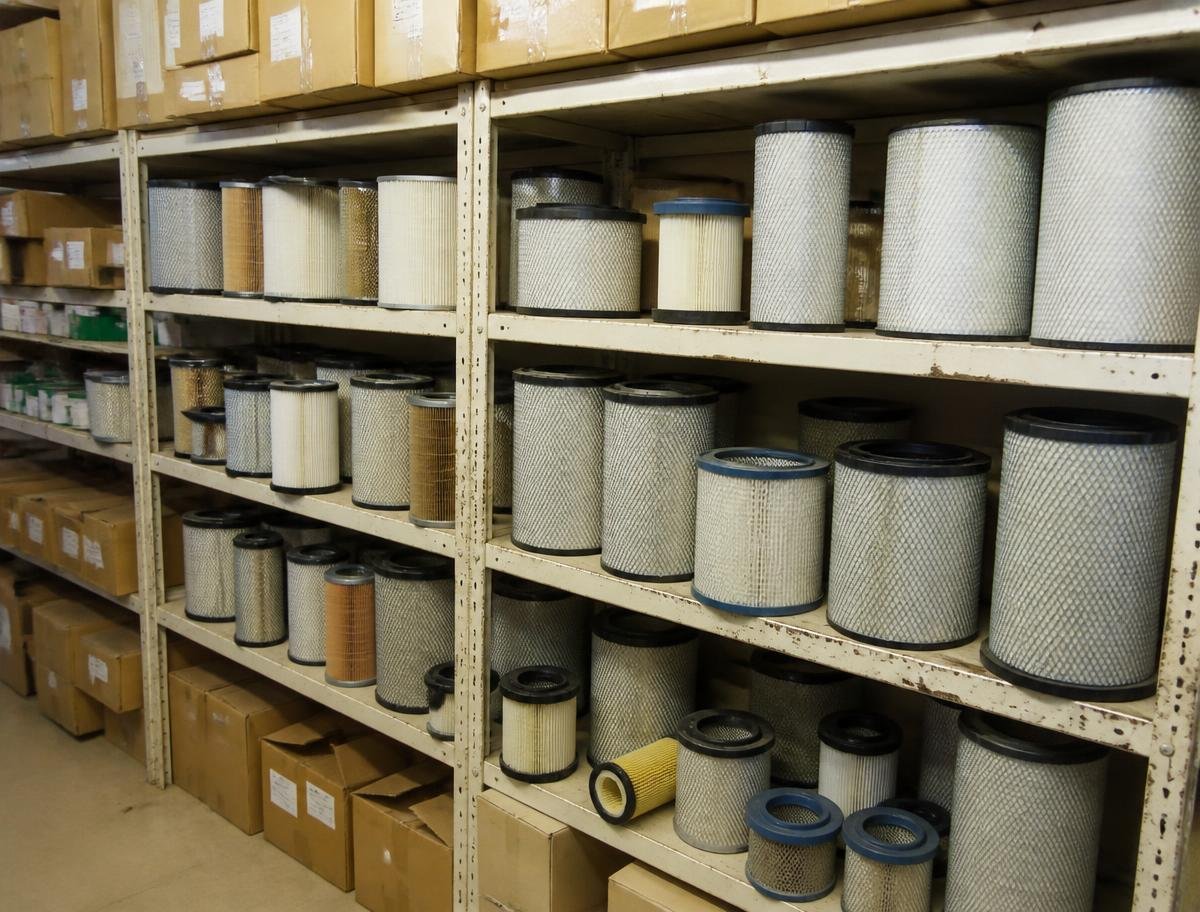 Rows of air, oil and fuel filters on workshop shelves